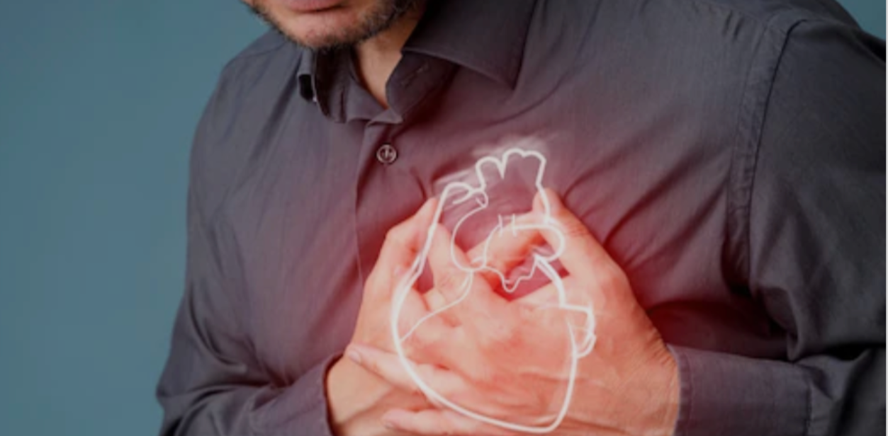 Image of man holding aching heart in background. Headshot of RTSL director Dr. Indu Bhushan and CNBC-TV18 log