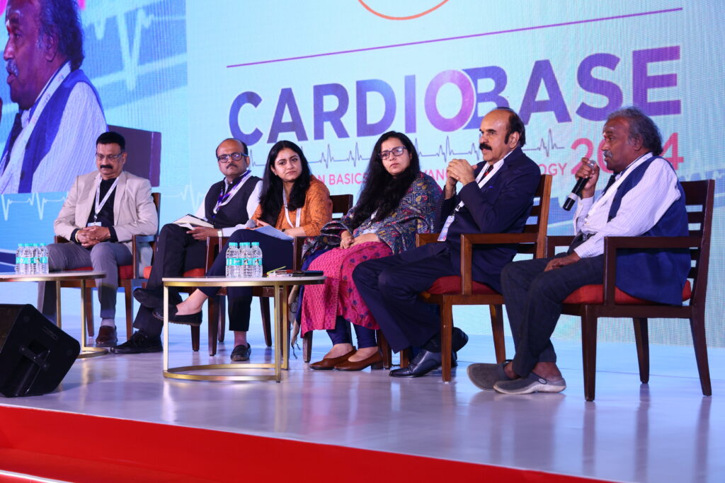 image of Dr. Amit, Dr. Manika, Dr. Swati, and Dr. Murugunathan on stage for a panel discussion for the CARDIOBASE 2024 panel