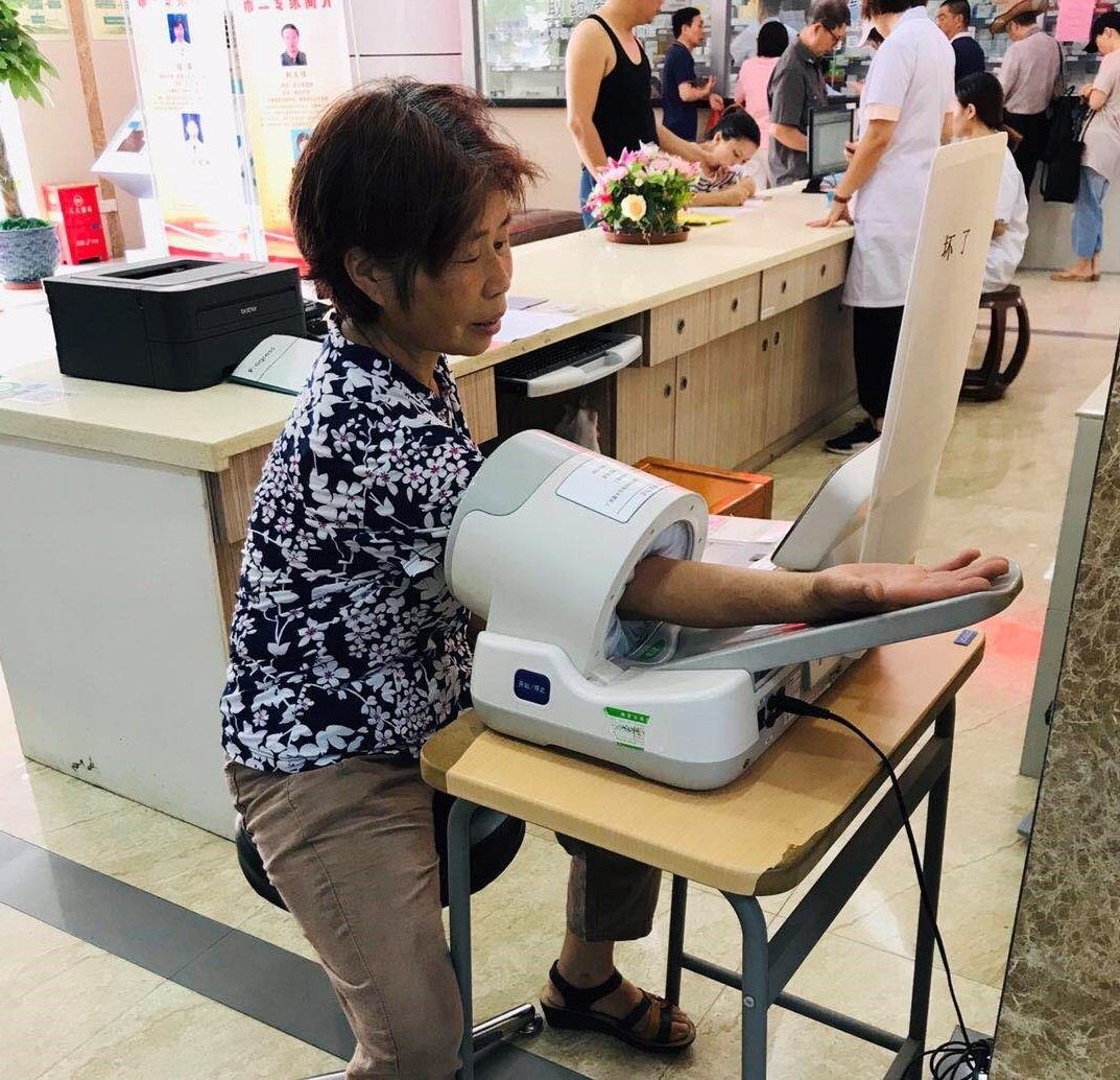 A woman has her blood pressure checked with a validated monitor as part of the China Rural Hypertension Control Project