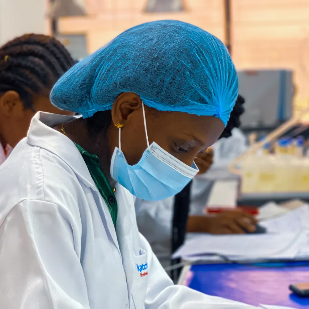 An Indian woman holding blood pressure medication