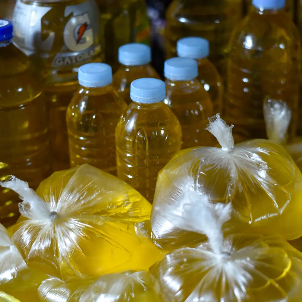 A Nigerian man and woman holding up a copy of the sodium report