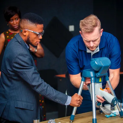 Two men operating an X-Ray machine